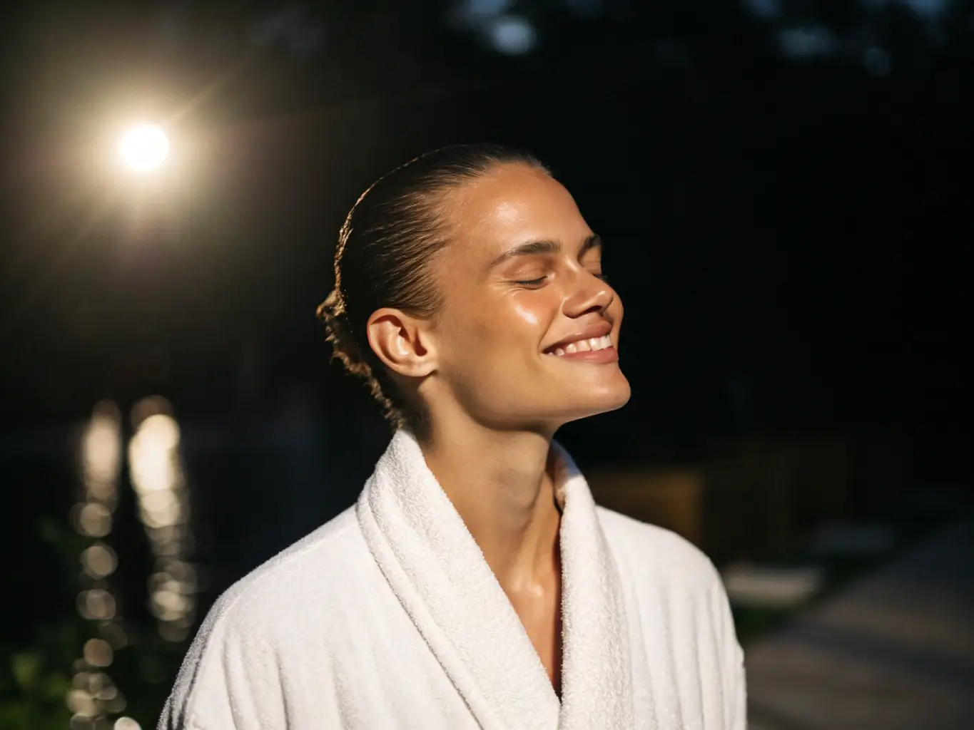 A close-up shot of a woman's radiant face after using a collagen mask, emphasizing the reduction of fine lines and enhanced skin texture. The background is soft and blurred, highlighting the natural glow.